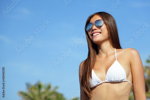 Photo: Asian bikini woman wearing sunglasses Asian bikini woman wearing sunglasses