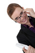 Smiling businesswoman holding laptop