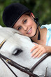 A portrait of a woman and her horse.
