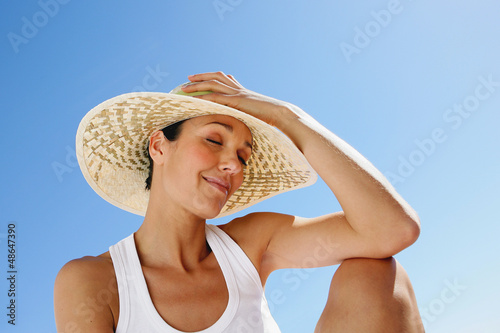 Photo: Woman with straw hat Woman with straw hat