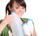 Young woman recycling plastic bottles
