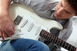 Young man with an electric guitar