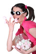 Photo: Candy-sweet woman with a jar a marshmallows Candy-sweet woman with a jar a marshmallows