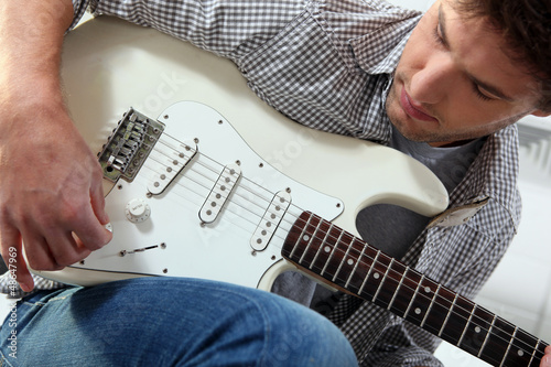 Photo: Young man with an electric guitar Young man with an electric guitar