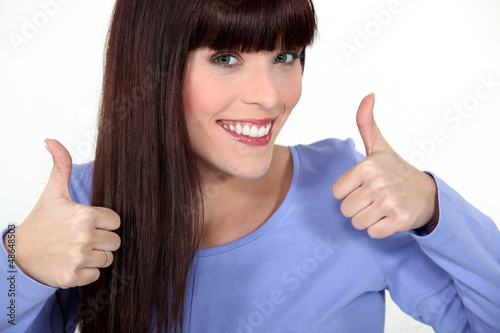 Photo: Attractive woman giving two thumbs up Attractive woman giving two thumbs up