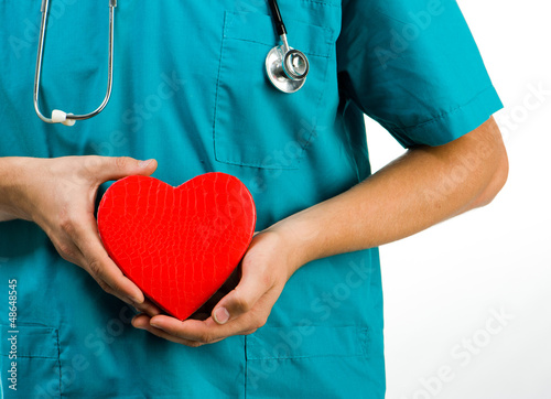 Photo: doctor holding a heart symbol doctor holding a heart symbol