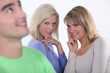 Two girls lusting over man