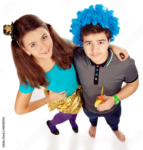 Photo: two teens or students have fun on party drinking cocktail two teens or students have fun on party drinking cocktail