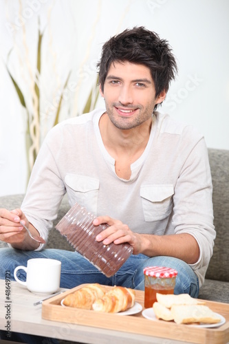 Photo: man eating breakfast man eating breakfast