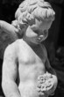 marble sculpture of angel with flowers in hand