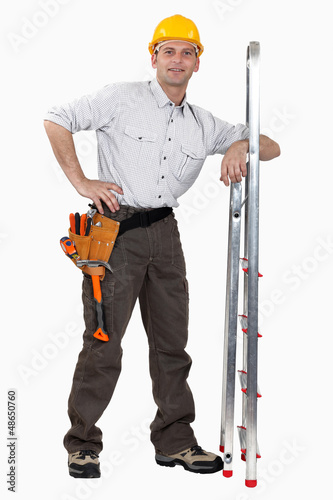 Photo: Tradesman leaning against a stepladder Tradesman leaning against a stepladder