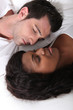 Couple laying in bed