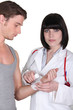 Doctor bandaging a wrist