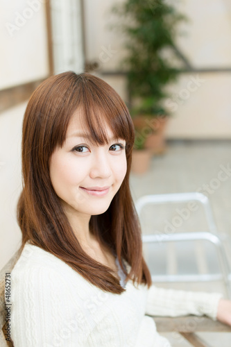 Photo: Beautiful young woman relaxing in the room Beautiful young woman relaxing in the room
