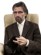 businessman sitting in chair with wallet