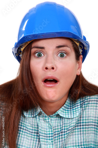 Photo: Shocked woman in a hard hat Shocked woman in a hard hat