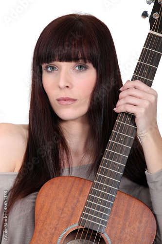 Photo: Busker posing with her guitar Busker posing with her guitar