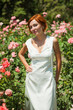 Photo: beautiful woman in roses garden beautiful woman in roses garden