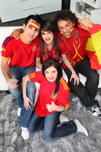 Photo: A group of friends supporting the Spanish football team A group of friends supporting the Spanish football team