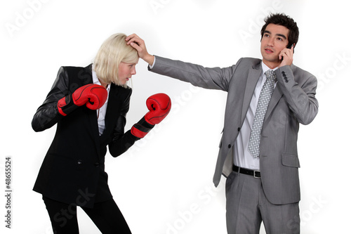Photo: Man taking a break from fighting with his colleague Man taking a break from fighting with his colleague