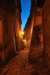 Photo: Old, stone street with lantern at dusk. Lublin in Poland. Old, stone street with lantern at dusk. Lublin in Poland.