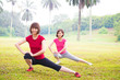 Two Asian girls stretching