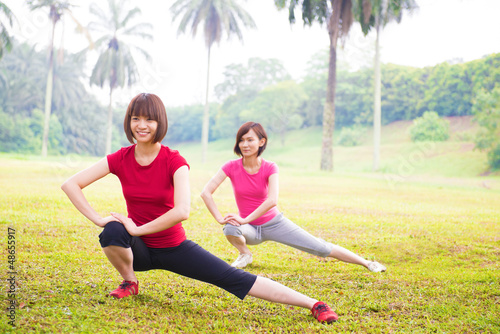 Photo: Two Asian girls stretching Two Asian girls stretching