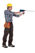 Man with a masonry drill