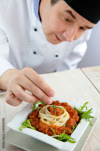 Photo: Male chef in restaurant Male chef in restaurant