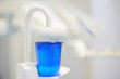 Cup of water in the dentist office.