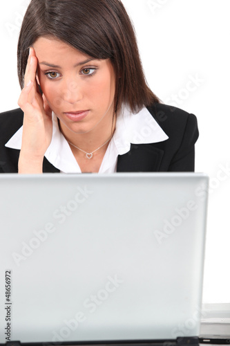 Photo: Bored woman in front of computer Bored woman in front of computer