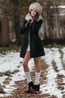 Photo: Sexy beautiful brunette girl in winter clothes in park Sexy beautiful brunette girl in winter clothes in park