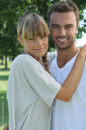 Photo: Portrait of a young couple in the countryside Portrait of a young couple in the countryside