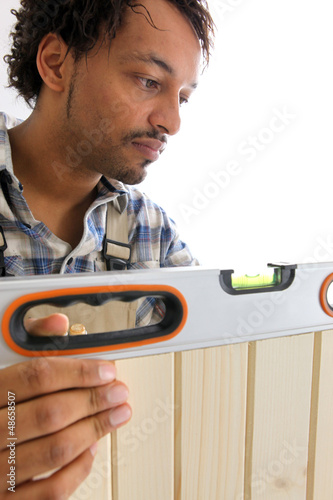 Photo: craftsman taking measurements with a level craftsman taking measurements with a level