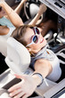 Photo: Happy girl in the car with her hands up Happy girl in the car with her hands up
