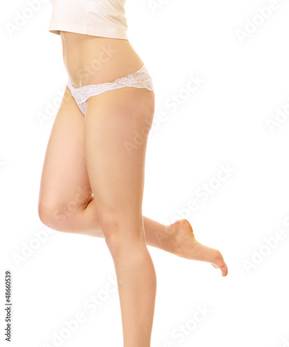 Photo: Beautiful female legs, isolated in white background Beautiful female legs, isolated in white background