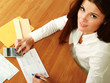 Young woman using a calculator