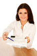 Businesswoman giving you the pen