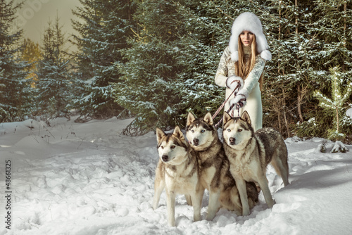 Photo: Fashion portrait of beautiful woman with three dogs Fashion portrait of beautiful woman with three dogs