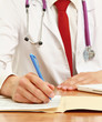 The doctor writing on the desk