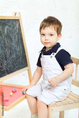 Photo: Child Drawing With Chalk Child Drawing With Chalk