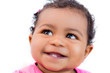 Beautiful ethnic 9 month old baby looking up and smiling