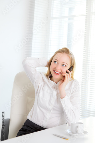 Photo: Office Girl Talking on Phone Office Girl Talking on Phone