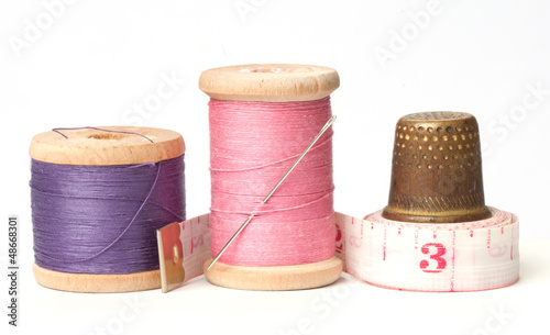 Photo: Old thimble and needles with thread Old thimble and needles with thread
