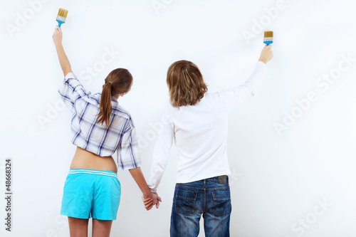Photo: Couple with paint brushes Couple with paint brushes