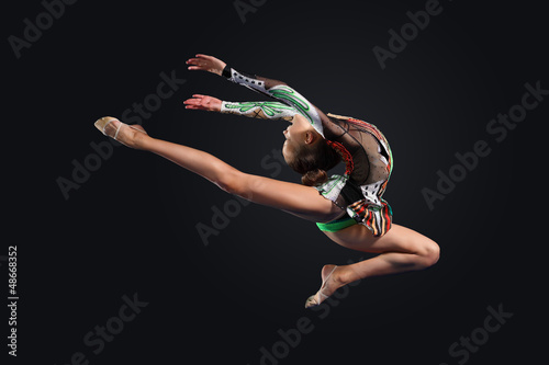 Photo: Young woman in gymnast suit posing Young woman in gymnast suit posing