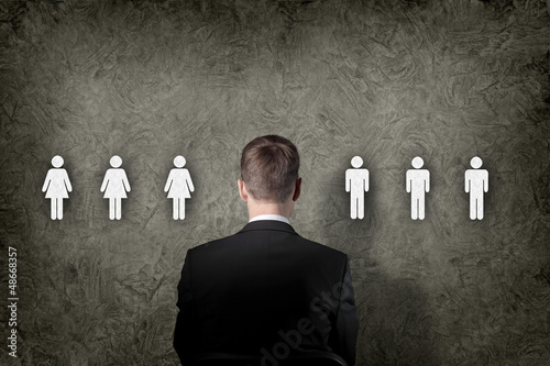 Photo: Businessman choosing between people Businessman choosing between people