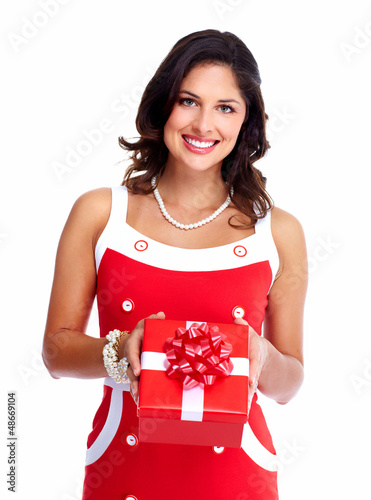 Photo: Beautiful young girl with a Christmas present. Beautiful young girl with a Christmas present.