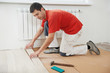 carpenter worker joining parket floor