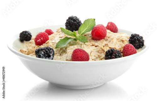 Photo: tasty oatmeal with berries, isolated on white tasty oatmeal with berries, isolated on white